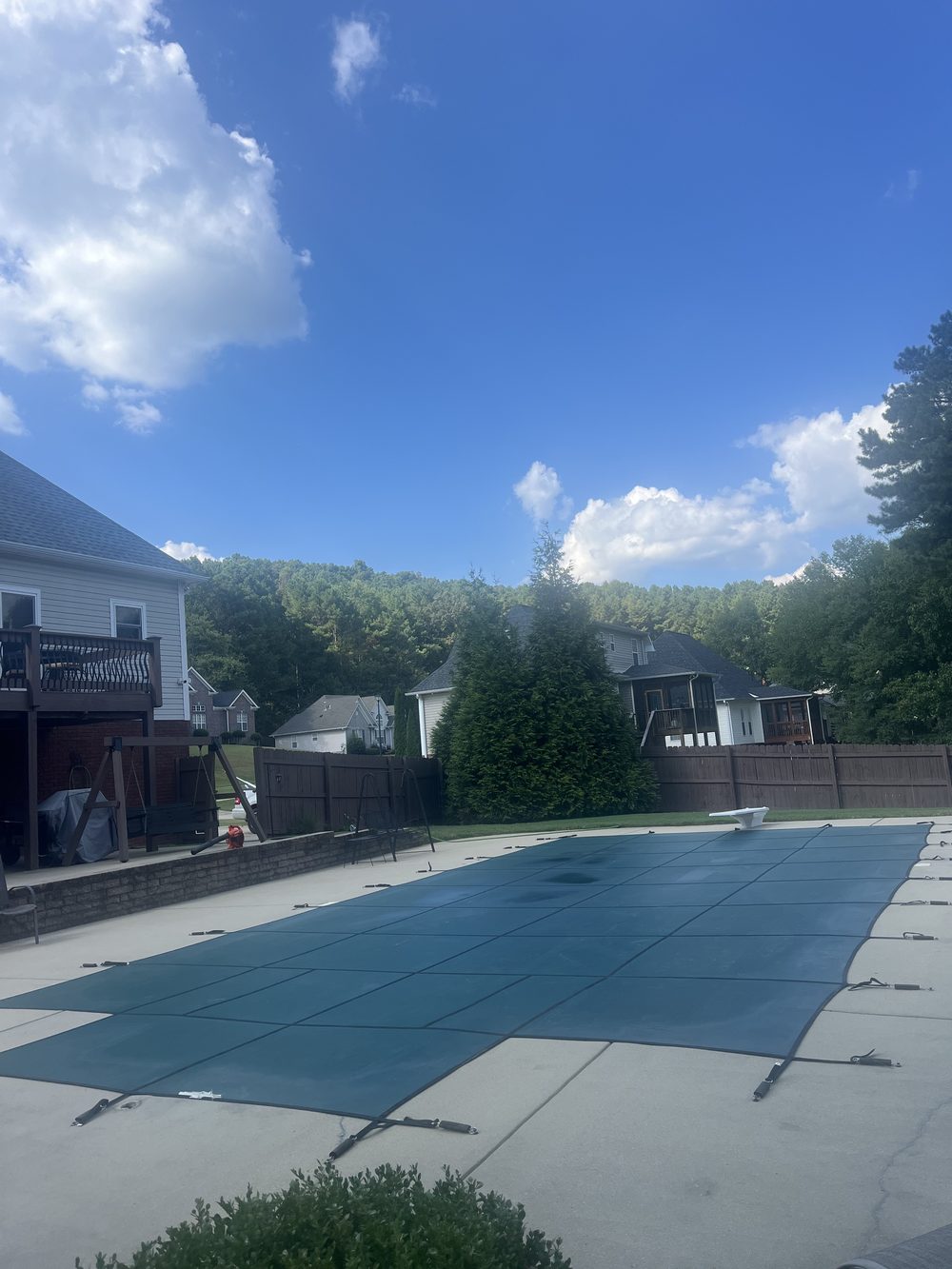 Pool secured with a mesh safety cover for closing