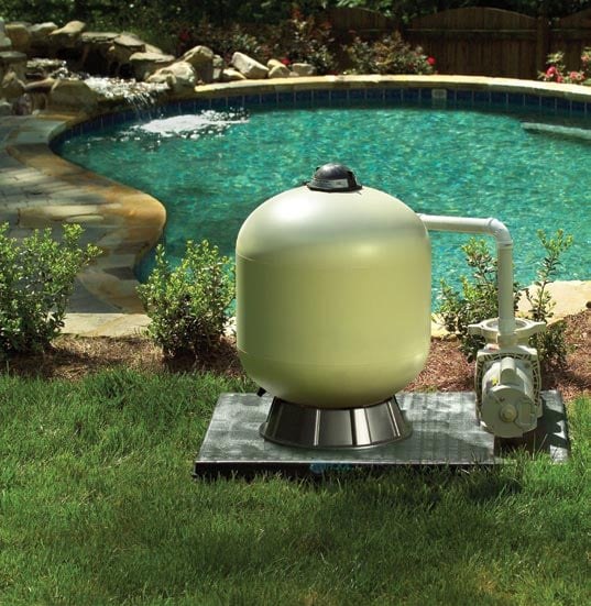 Sand filter installed poolside